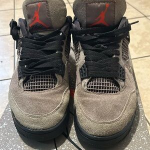 Used Jordan 4 Taupe size 8. Missing inside support wing on right sneaker.